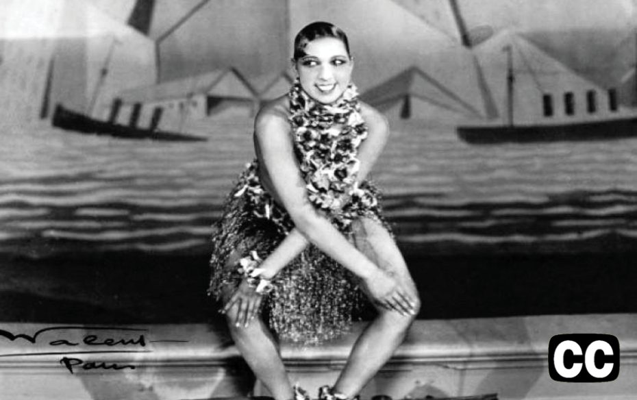 A black-and-white photo of performer Josephine Baker dancing on stage.