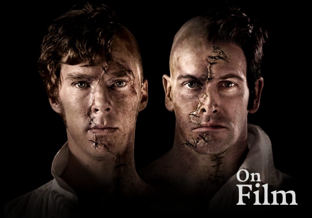 Actors Benedict Cumberbatch and Jonny Lee Miller in Frankenstein. Their faces are both stitched up.
