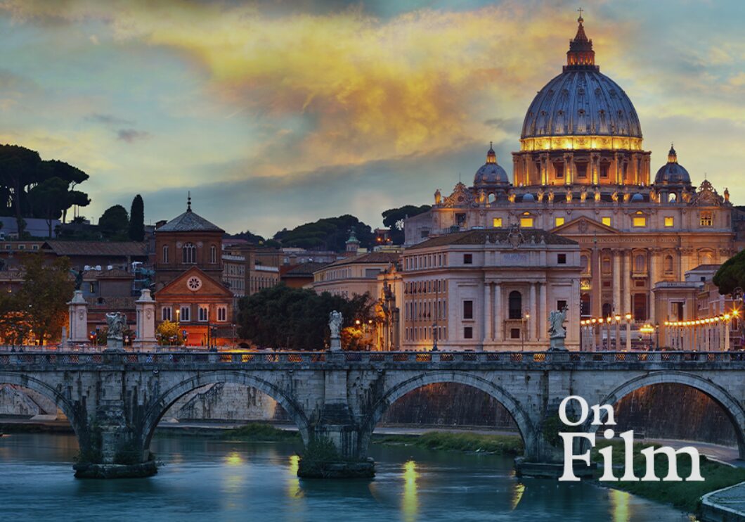 Saint Peter’s Basilica and its surroundings. Its lights are reflecting in the river.
