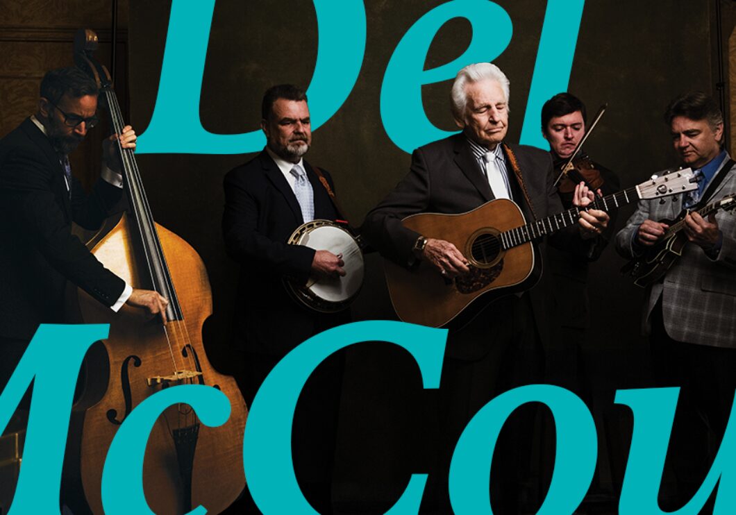 The Del McCoury Band holding their instruments, with text that says, "The Del McCoury Band."