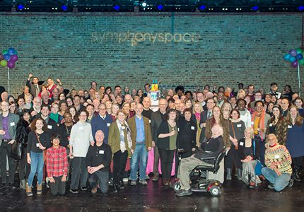 The staff and supporters of Symphony Space joyfully gathered on the stage of the Sharp Theatre.
