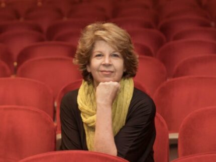 Meg Wolitzer sits in the audience of the Sharp theatre at Symphony Space.