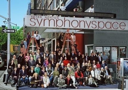 The staff and supporters of Symphony Space gather joyfully in front of the theater on West 95th Street.